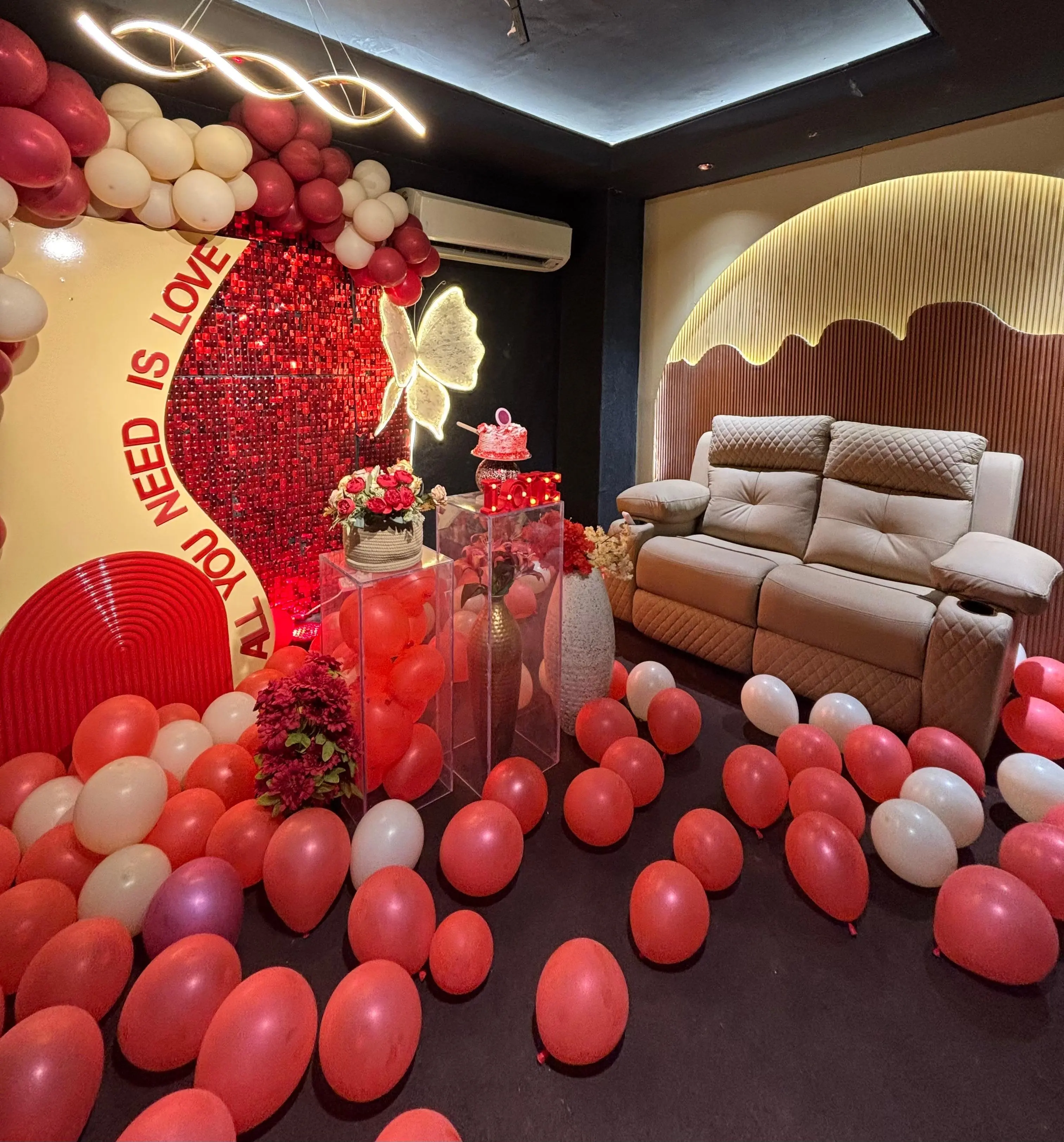 Candlelit romantic dinner setup inside a private theater celebration suite