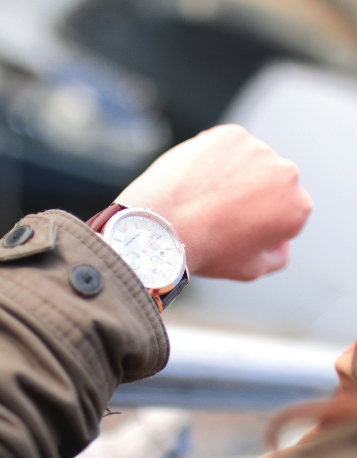 Hourglass with sand forming figures of people inside